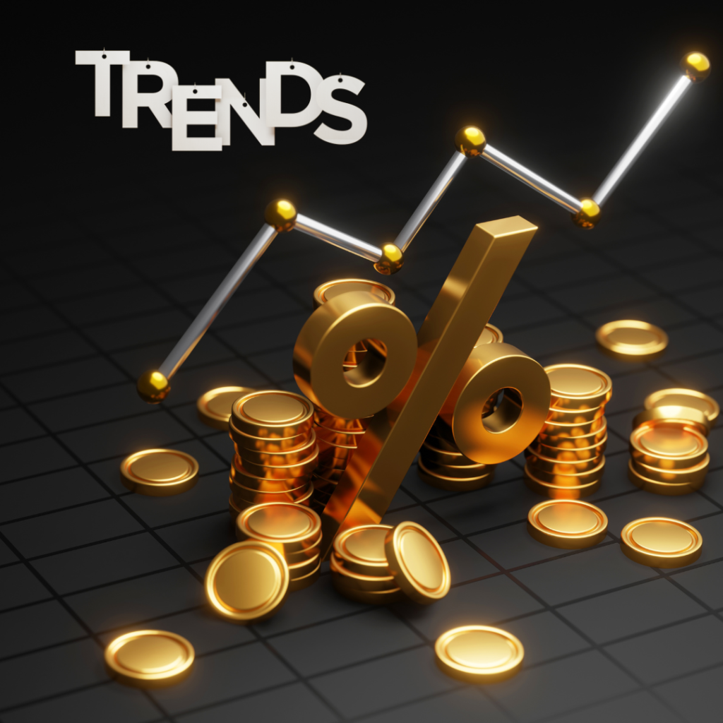 Visual representation of gold market trends, featuring the word 'TRENDS' suspended on a yellow background and a dynamic chart rising above stacked gold coins, symbolizing growth and market movement in gold trading.